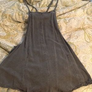 Grey moped with pockets on back